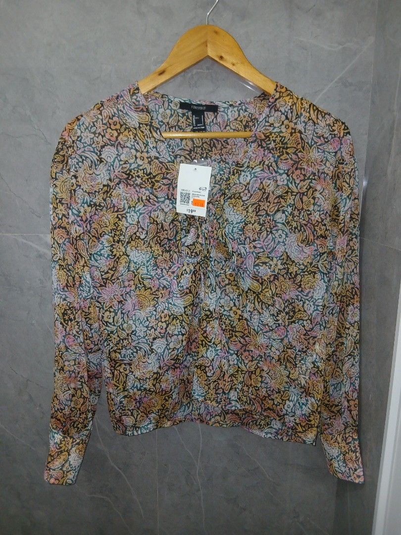 NWT small -medium forever21 sheer long-sleeved top from U.S (Category: Blouses) located in Marikina City. Submitted by lanadelrey0002 (Listing ID 1465743334, Image 2). Description: no actual pics when worn mop: BDO.PNB. MAYA same day delivery grab or lalamove j&t : 54 pesos Luzon and 74 pesos Visayas ,Mindanao.