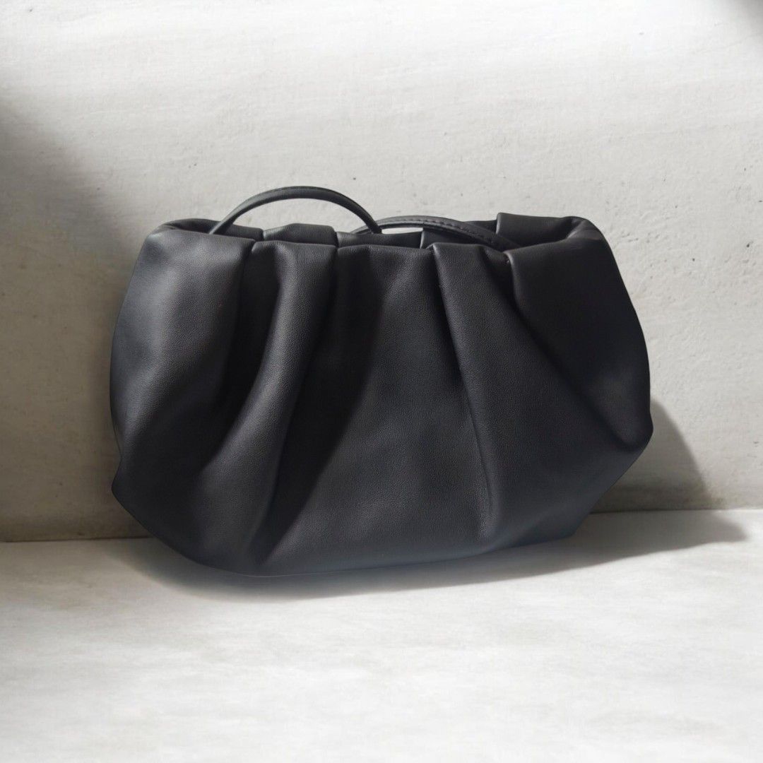 Oak + Fort Black Ruched Cloud Bag (Category: Shoulder Bags) located in Antipolo. Submitted by goodsinger (Listing ID 1465583323, Image 2). Description: - Brand: Oak and Fort - Color: Classic Black - Material: Soft faux leather (clean inside and out) - Design: Puffed gathered cloud bag style with thin straps - Closure: Top magnetic closure - Interior: Fabric-lined with brand tag and convenient side pocket - Style: Great everyday minimalist purse.