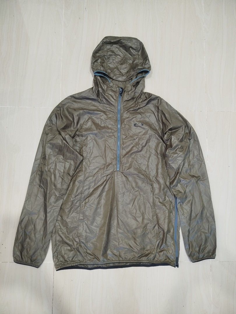 Oakley Enhanced Wind Anorak jacket (Category: Coats, Jackets and Outerwear) located in Aroroy. Submitted by dr0p-a-dr1p (Listing ID 1465647551, Image 1). Description: Width: 21 Length l: 27 - Brand: Oakley - Color: Olive green - Size/Fit: M to L - Material: Durable ripstop fabric - Features: Half-zip front closure, attached hood, and side zipper for easy wear and ventilation - Origin: Made in Vietnam - Ideal for: Outdoor runs or breezy weather la