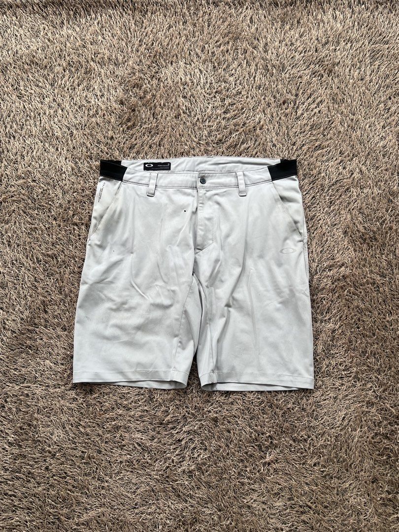 Oakley Grey Golf Shorts Y2K Vintage Streetwear | Nike Adidas Jordan Ralph Lauren Tommy Hilfiger Lacoste Levi's Carhartt Dickies Burberry Stussy Bape (Category: Shorts) located in Digos. Submitted by nasosaaa (Listing ID 1465700768, Image 1). Description: - Brand: Oakley - Color: Light Grey - Size: 32 (Tagged) - Features: Stretch waistband inserts for mobility, button closure, zip fly, and belt loops - Pockets: Standard front and back pockets - Co