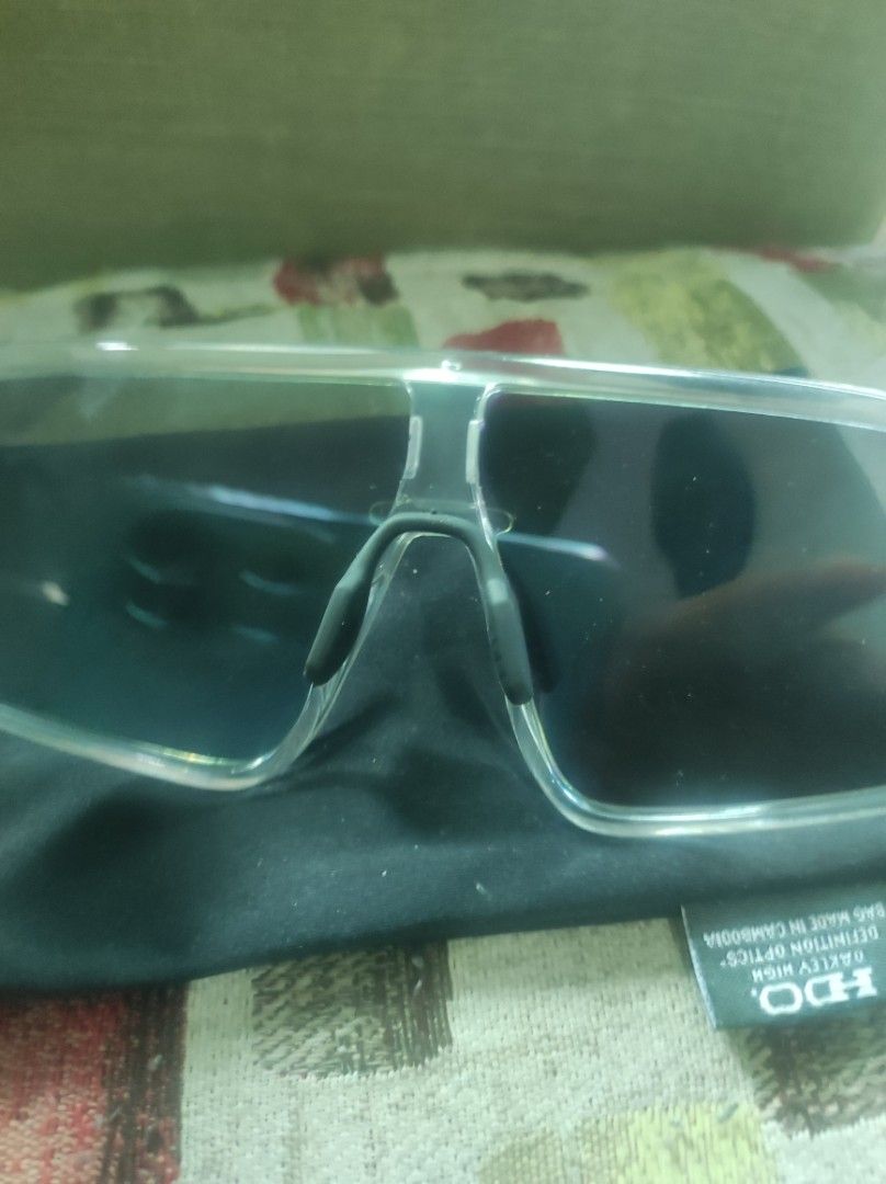Oakley Latch Panel Sunglasses Clear Frame (Category: Sunglasses & Eyewear) located in Pasay City. Submitted by wizemindz138970 (Listing ID 1465647544, Image 3). Description: - Model: Oakley Latch Panel (OO9404-0332) - Frame: Clear with transparent side shields on temples - Lenses: Reflective purple, extremely clean with no scratches - Design: Lightweight, ideal for outdoor sports and casual wear - Inclusion: Comes with original black microfiber s