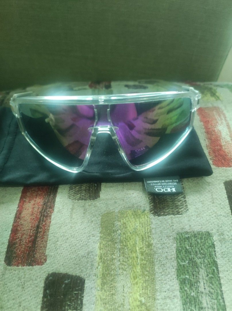 Oakley Latch Panel Sunglasses Clear Frame (Category: Sunglasses & Eyewear) located in Pasay City. Submitted by wizemindz138970 (Listing ID 1465647544, Image 1). Description: - Model: Oakley Latch Panel (OO9404-0332) - Frame: Clear with transparent side shields on temples - Lenses: Reflective purple, extremely clean with no scratches - Design: Lightweight, ideal for outdoor sports and casual wear - Inclusion: Comes with original black microfiber s