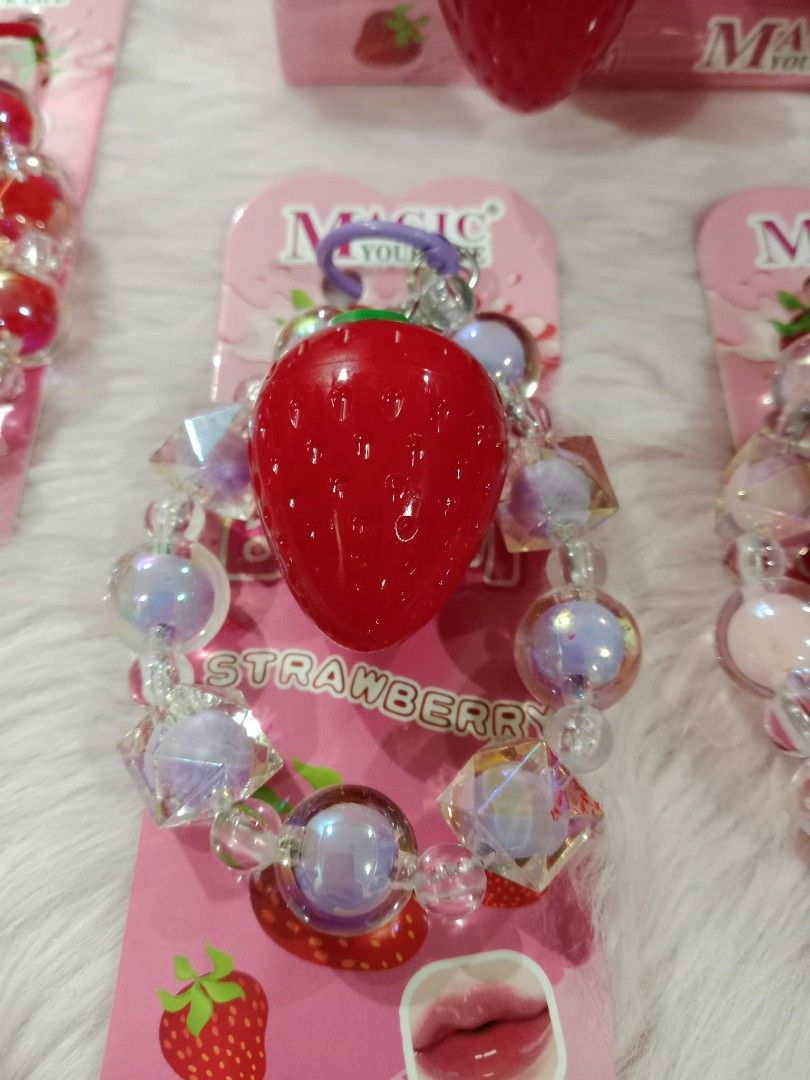 Obuse Strawberry Magic Lip Balm packaged with a decorative beaded charm strap (Category: Makeup) located in Taguig. Submitted by smushypotatoo2.0 (Listing ID 1465747308, Image 3). Description: .