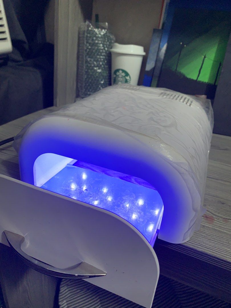 Odenpres Dental Depot Curing Light Box (Category: Medical Supplies & Tools) located in Manila. Submitted by hausali90 (Listing ID 1465637125, Image 1). Description: - Brand/Source: Odenpres Dental Depot white curing light unit - Condition: Fully functional with working internal LED lights, still has original protective plastic wrap - Tray: Pull-out tray with a blue reflective surface - Controls: Main power switch, start/pause button, and timer se