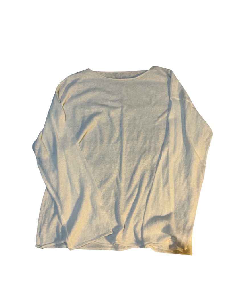 Off-white long sleeve lightweight knit sweater top (Category: Longsleeves) located in Bulacan. Submitted by whimsylilies (Listing ID 1465669462, Image 1). Description: - Color: Off-white / Cream - Material: Lightweight, soft knit - Fit: Loose, comfortable, relaxed dropped shoulders - Neckline: Simple round neck - Style: Versatile basic for easy pairing with jeans or skirts - Condition: Brand new / Excellent (ready to wear) - See through, M-L size