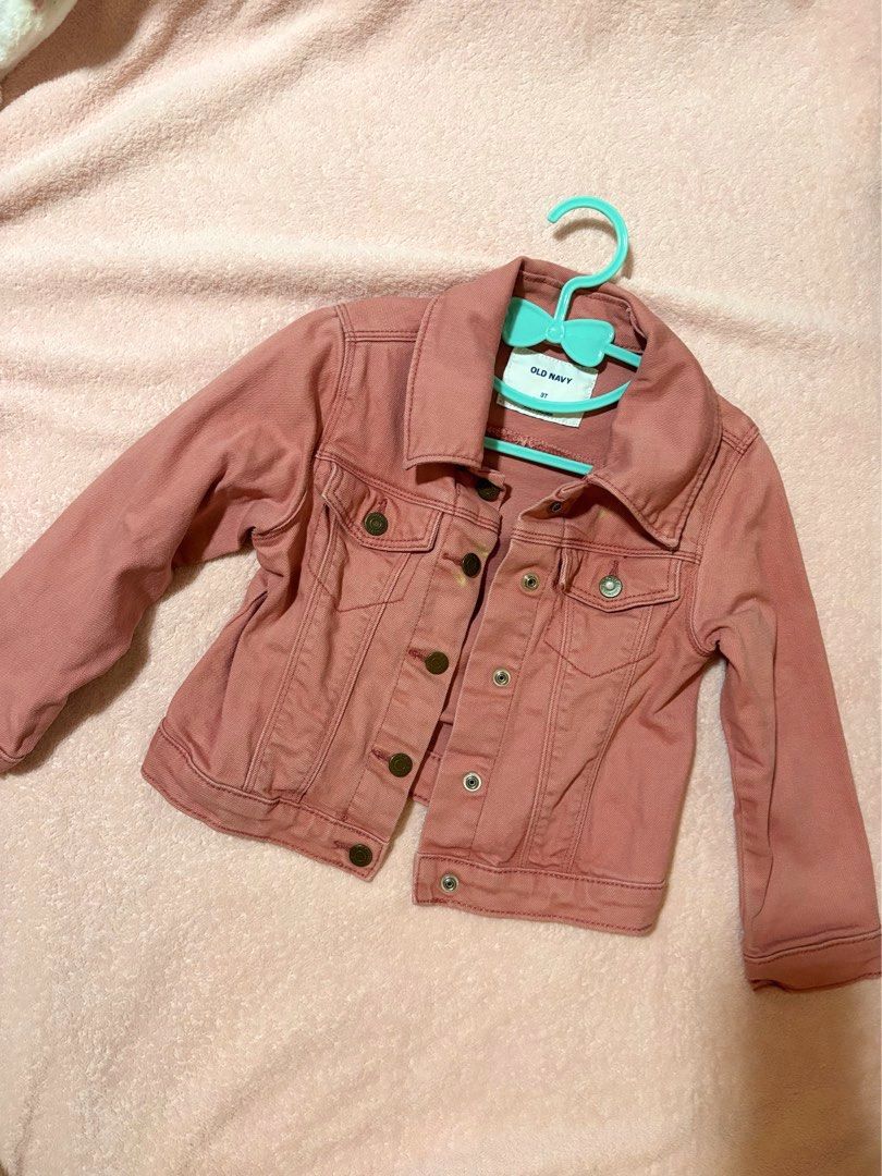 Old Navy pink denim jacket (Category: Babies & Kids Fashion) located in Quezon City. Submitted by closettreasure123 (Listing ID 1465263246, Image 1). Description: There’s a small bleached part on the 3rd pic. with front button pockets and a classic collar..