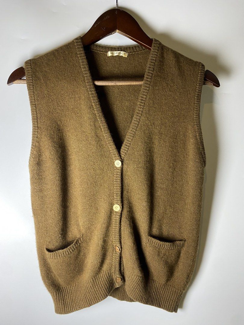 Olive brown button vest with pockets (Category: Others Tops) located in Makati City. Submitted by indaysukaycloset (Listing ID 1465645313, Image 1). Description: OLIVE BROWN BUTTON VEST WITH POCKETS Brand: ALDRIDGE Size: Free Size / Fits s-M Color: Olive Brown / Khaki Brown Details: - V-neck button-down vest cardigan - Front button closure (4 buttons) - 2 front patch pockets with ribbed trim - Ribbed hem and armholes - Soft knit, makapal, old mon