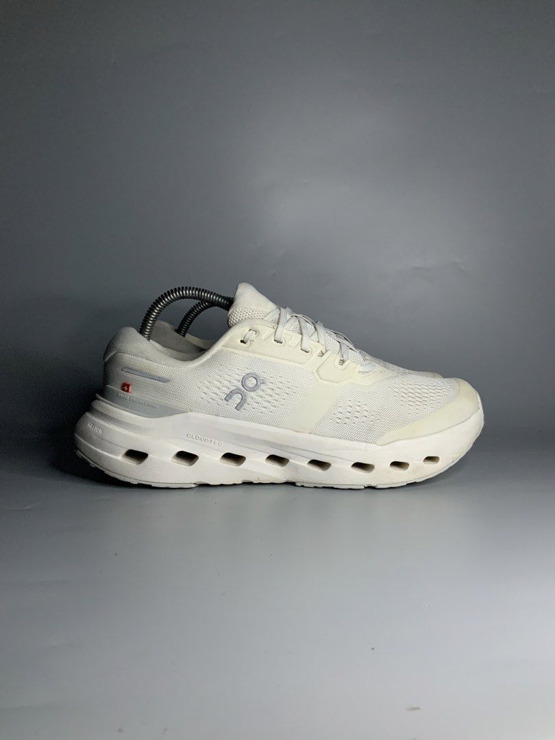On CloudRunner 3 (Category: Sneakers) located in Cavite. Submitted by kalye_footwear (Listing ID 1465713928, Image 2). Description: - Brand/Model: On CloudRunner 3 - Color: Crisp White with Swiss flag detail - Size : Us 8 , Euro 41 , Cm 26 - Key Features: Chunky Helion superfoam sole, CloudTec cushioning, breathable mesh upper, and silver reflective accents - Condition: Pre-loved with minor signs of wear around the sole edges and toe guard - Incl