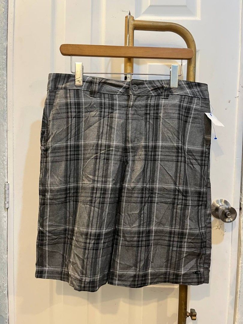 O'Neill Grey Plaid Shorts Size 34 (Category: Shorts) located in Quezon City. Submitted by chicberry (Listing ID 1465719205, Image 1). Description: - Brand: O'Neill - Style: Plaid shorts (Grey, black, and white tones) - Size: Men's 34 waist - Material: Comfortable cotton and viscose blend - Features: Button closure, belt loops, and back pockets with button flap closure - Details: Embroidered logo text above the right back pocket - Care: Machine wa
