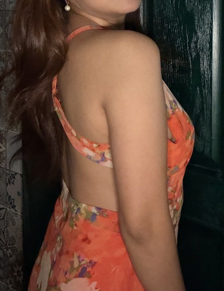 Orange Floral Halter Dress Open Back (Category: Dresses) located in Calamba. Submitted by miss.ksnap (Listing ID 1465645562, Image 3). Description: - Style: Halter midi dress with cowl neckline and open back - Design: Vibrant orange with an all-over pink floral pattern - Material: Lightweight and breathable, easy to slip on - Condition: Excellent, worn only once for a dinner - Perfect for: Warm weather, resort wear, or a night out.