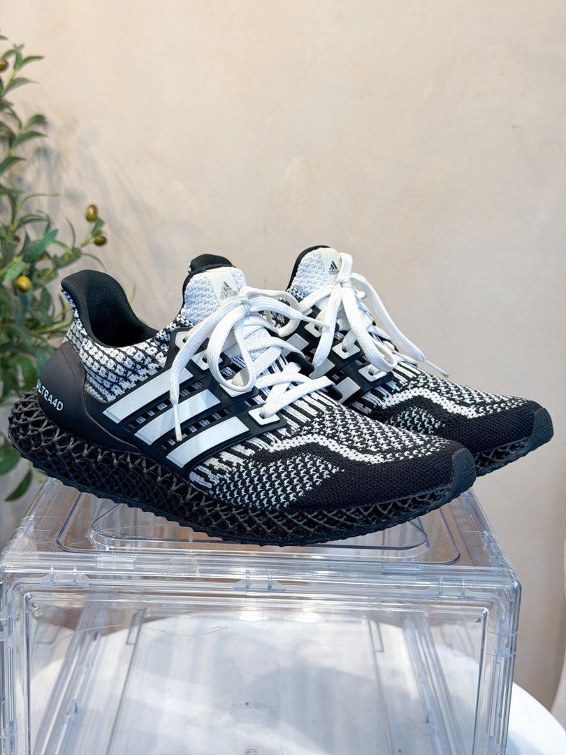 Original Adidas Ultra 4D Boost OREO Cookies (Category: Sneakers) located in San Pedro. Submitted by maylynart09522 (Listing ID 1465659397, Image 2). Description: Original Adidas Ultra 4D Boost OREO Cookies • size 8 (us) • used, pero matagal to nakastock lang sa acrylic box • no box included • free acrylic box • 8/10 condition, issue crack na yung logo sa may front, yun lang ang issue nya other than that bagong bago pa ₱7,500 + shipping fee (sligh