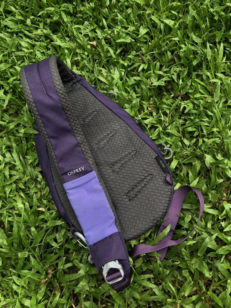 Osprey Daylite Sling Backpack Purple (Category: Backpacks) located in Kabasalan. Submitted by hamugaway (Listing ID 1465755109, Image 2). Description: Osprey Daylite sling bag in purple. Compact single-strap design, comfortable padded back panel. Main compartment includes internal mesh pocket with zipper closure. Exterior features another zippered pocket and adjustable strap with buckle. Tag attached inside with manufacturing details. Clean fabri