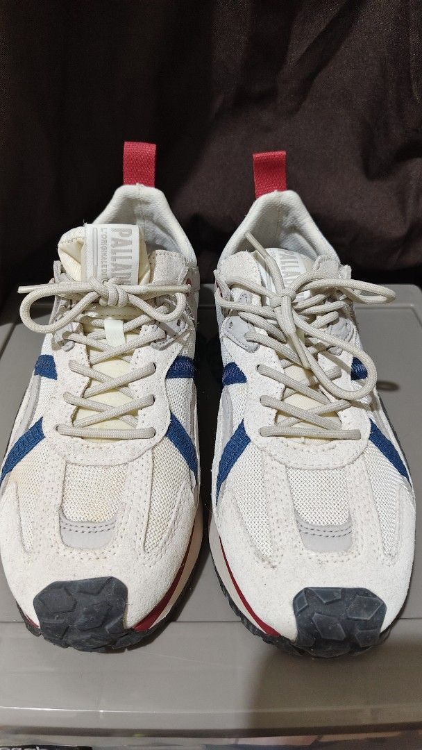 Palladium sneakers (Category: Sneakers) located in Quezon City. Submitted by patrasche (Listing ID 1465587192, Image 1). Description: Palladium low-top sneakers in off-white, blue, and red colorway. Chunky rugged outsole with big Palladium lettering on the bottom. Leather and mesh panels across the upper. Red pull tab on the heel. Size UK 8, US 9, EUR 42, MM 270..