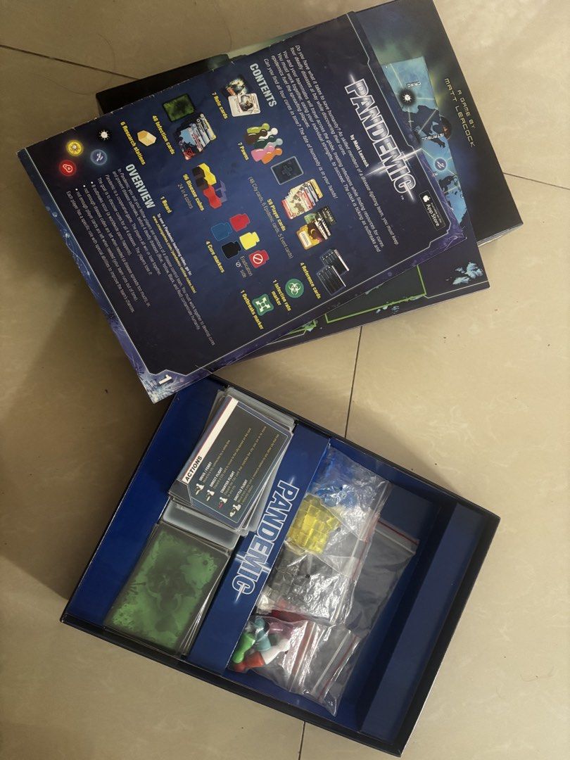 Pandemic Board Game Z-Man Games (Category: Board Games & Puzzles) located in Andop. Submitted by fammie_frayyss (Listing ID 1465621996, Image 2). Description: - Game: Pandemic (Cooperative board game by Matt Leacock) - Objective: Work together to save humanity from global diseases - Includes: Game board, rulebook, role cards, player cards, infection cards, pawns, disease cubes, and markers - Condition: All components neatly packed inside the orig