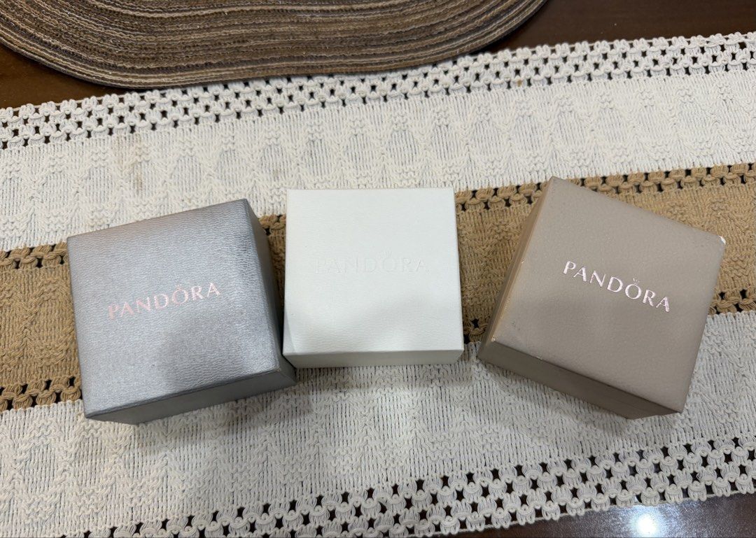 Pandora Bracelet Boxes Set of Three (Category: Accessory Holder, Box & Organizers) located in Lipa City. Submitted by michellesclosetph (Listing ID 1465658609, Image 1). Description: *With purchase worth 300 up - Authentic Pandora boxes (Set of 3: silver, white, beige) - Plush black velvet interior lining - Perfect for storing rings or small trinkets - Ideal for gifting or organization.