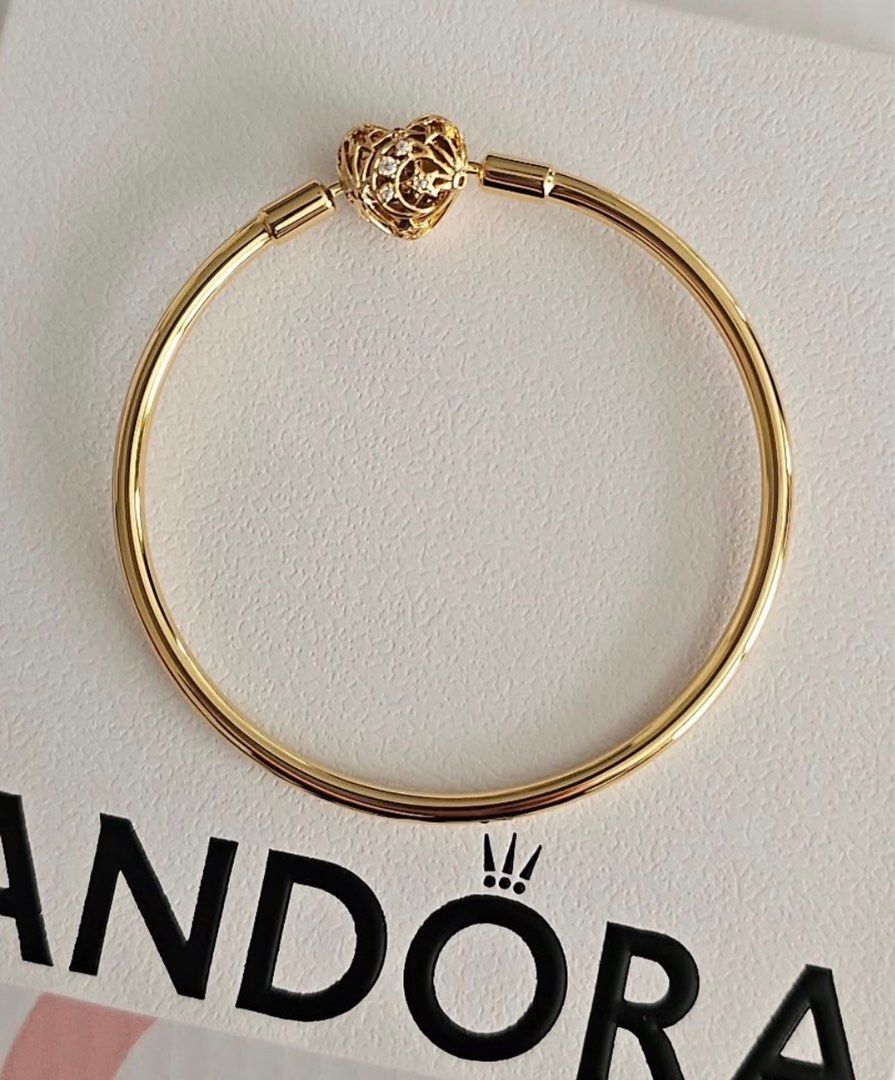 Pandora Celestial Heart Clasp Bangle (Category: Bracelets) located in Caloocan City. Submitted by shnicky101 (Listing ID 1465616706, Image 1). Description: Brand new Pandora Celestial Heart Clasp Bangle in Size 19cm. Features an openwork celestial heart detailed with clear cubic zirconia stones and finished in warm 14k gold plating. ✨ Item: Authentic Pandora Celestial Heart Clasp Bangle ✨ Size: 19cm ✨ Material: 14k Gold Plated ✨ Condition: Brand 
