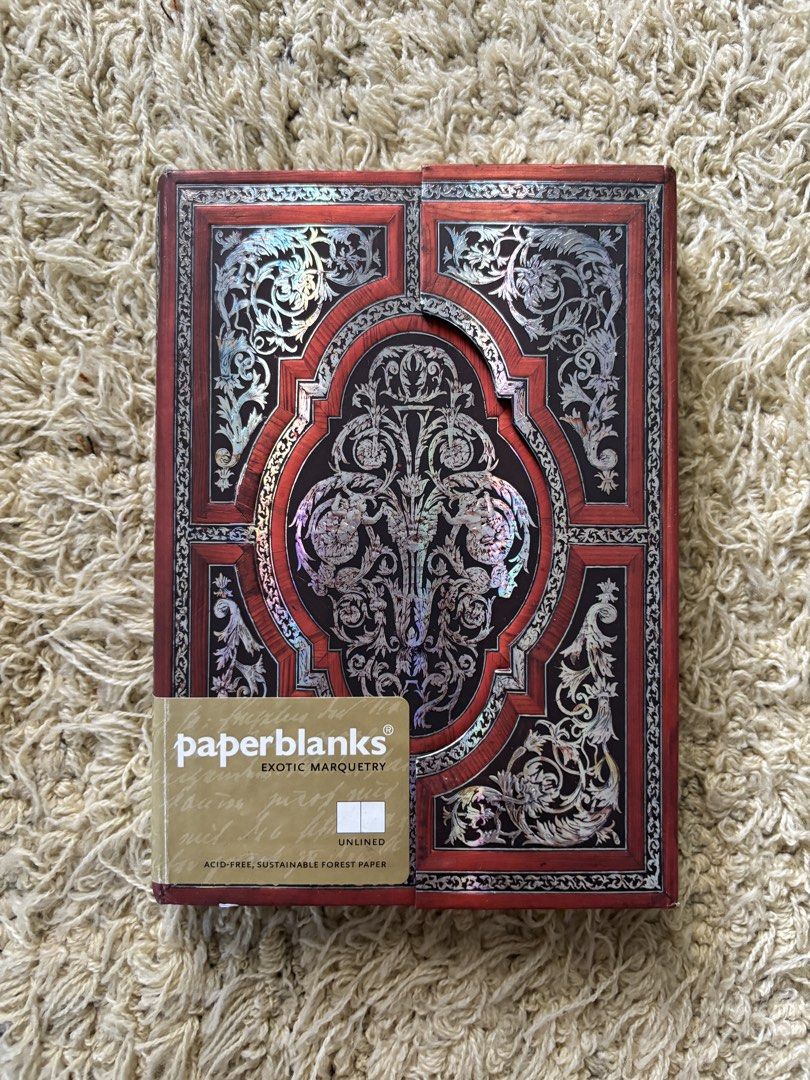 Paperblanks Exotic Marquetry Unlined Journal (Category: Other Stationery & Craft) located in Quezon City. Submitted by ghieshopppps (Listing ID 1465592627, Image 1). Description: Not used but old stock w/ minor imperfections Personal Collection Bought at Powerbooks P822.00 RFS : Need funds for my son's therapy expenses Mother of Pearl Midi Wrap Momento Pouch Smyth sewn binding Size : 12.5x17.5cm Unlined Sustainable Forest Paper 📚 Actual Journal 