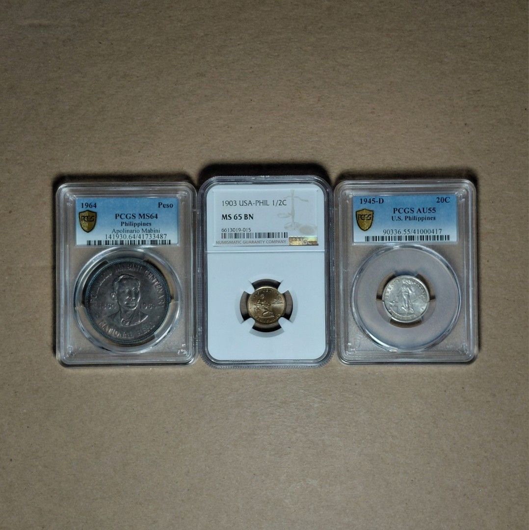 PCGS/NGC Graded Coins (Category: Currency) located in Tagbilaran City. Submitted by bennycollectibles (Listing ID 1465746016, Image 1). Description: •PCGS MS 64 Apolinario Mabini 1 Peso coin - 6k •PCGS AU 55 USPI 20 Centavos Coin - 2k •NGC MS 65 BN USPI ½ Centavo Coin - 10k •Free Shipping •16,500 if take all.