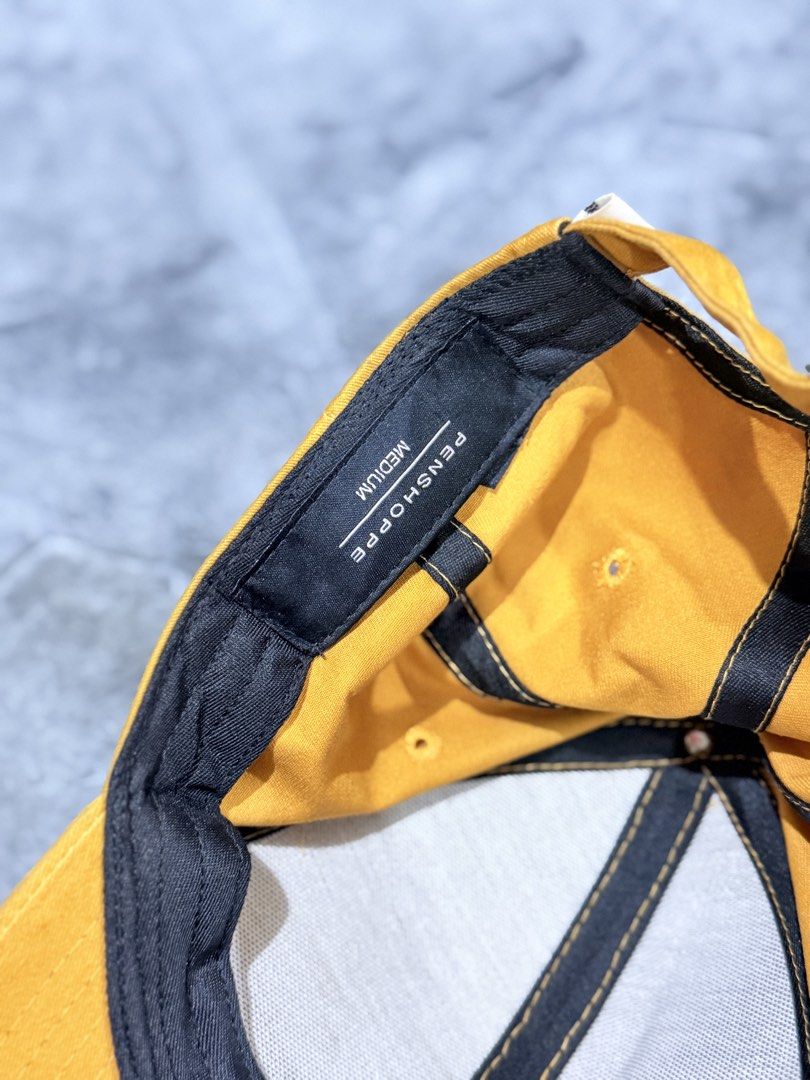 Penshoppe Mustard Yellow Baseball Cap Medium (Category: Caps & Hats) located in Tagaytay City. Submitted by belletrendss (Listing ID 1465649925, Image 2). Description: - Brand: Penshoppe - Color: Mustard yellow - Size: Medium - Design: Classic six-panel with embroidered eyelets - Brim: Curved - Details: Black inner sweatband with contrasting yellow stitching - Fit: Adjustable back strap Location: Tagaytay/Silang Free shipping for above 1k orders 