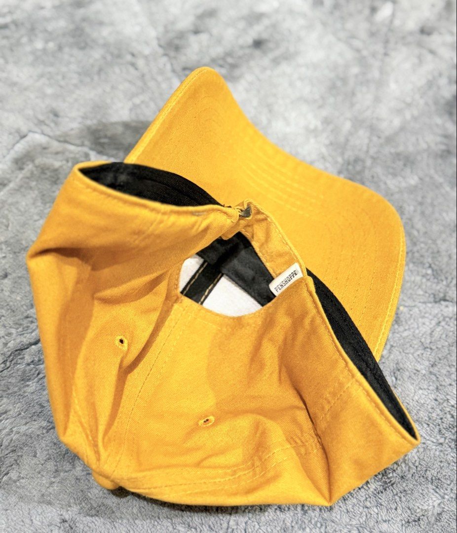 Penshoppe Mustard Yellow Baseball Cap Medium (Category: Caps & Hats) located in Tagaytay City. Submitted by belletrendss (Listing ID 1465649925, Image 3). Description: - Brand: Penshoppe - Color: Mustard yellow - Size: Medium - Design: Classic six-panel with embroidered eyelets - Brim: Curved - Details: Black inner sweatband with contrasting yellow stitching - Fit: Adjustable back strap Location: Tagaytay/Silang Free shipping for above 1k orders 