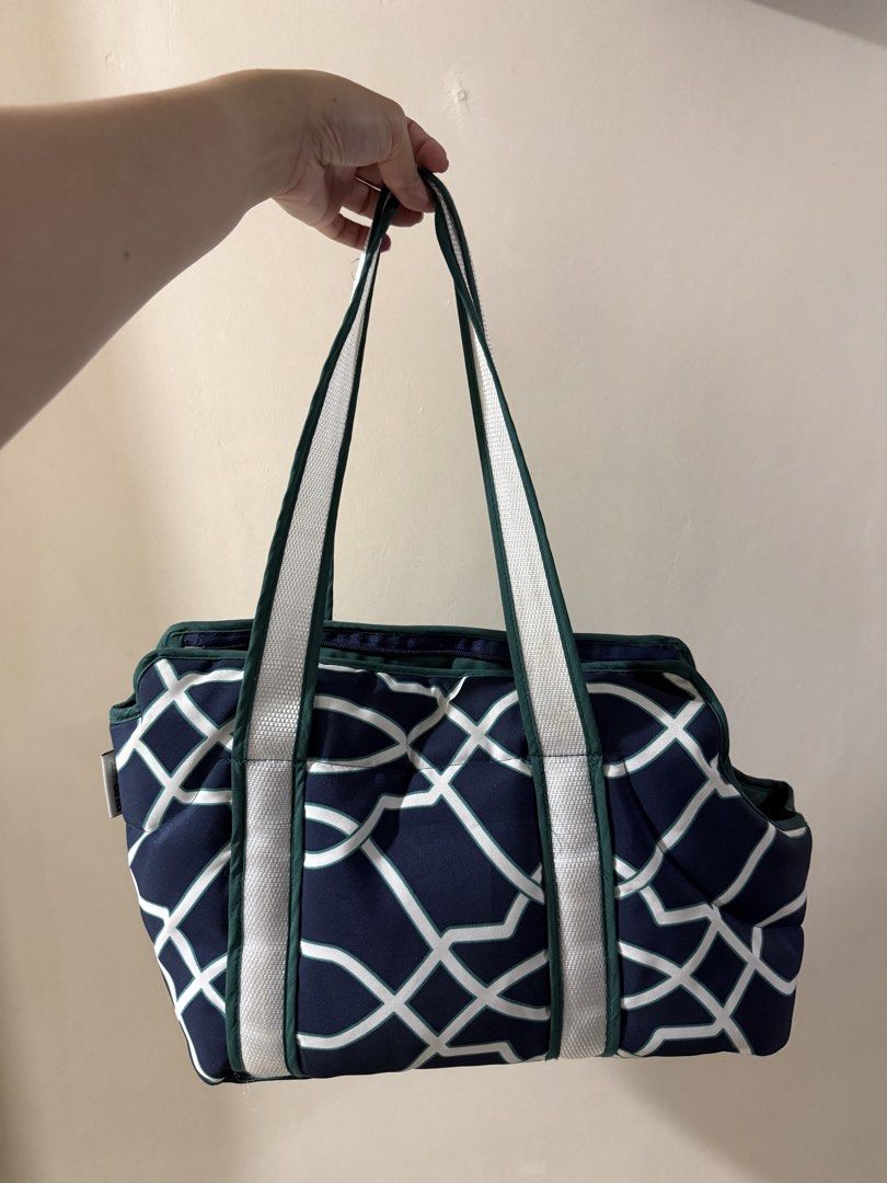 Pet Carrier Bag Navy Blue Geometric Pattern (Category: Homes & Other Pet Accessories) located in Quezon City. Submitted by jiaaa03_ (Listing ID 1465719202, Image 2). Description: - Color/Design: Navy blue with a chic white geometric lattice pattern - Interior: Cozy dark green quilted lining with a handy side pocket - Comfort: Includes a soft padded base for your pet - Straps: Sturdy white and green shoulder straps for easy carrying - Closure: Sec