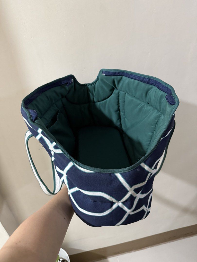 Pet Carrier Bag Navy Blue Geometric Pattern (Category: Homes & Other Pet Accessories) located in Quezon City. Submitted by jiaaa03_ (Listing ID 1465719202, Image 3). Description: - Color/Design: Navy blue with a chic white geometric lattice pattern - Interior: Cozy dark green quilted lining with a handy side pocket - Comfort: Includes a soft padded base for your pet - Straps: Sturdy white and green shoulder straps for easy carrying - Closure: Sec