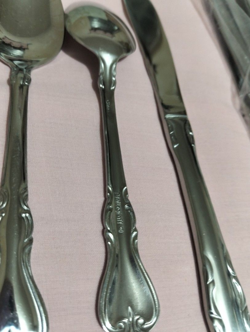 Pfaltzgraff Stainless Steel Flatware Cutlery Set (Category: Dinnerware & Cutlery) located in Manila. Submitted by bethistama04142 (Listing ID 1465620179, Image 3). Description: - Brand: Pfaltzgraff - Origin: Made in China - Material: Sturdy metal construction with a polished finish - Design: Elegant decorative scrollwork on handles - Set Includes: 10 pcs Dinner knives, 10 pairs of teaspoons & fork - Ideal for everyday dining or special occasions.