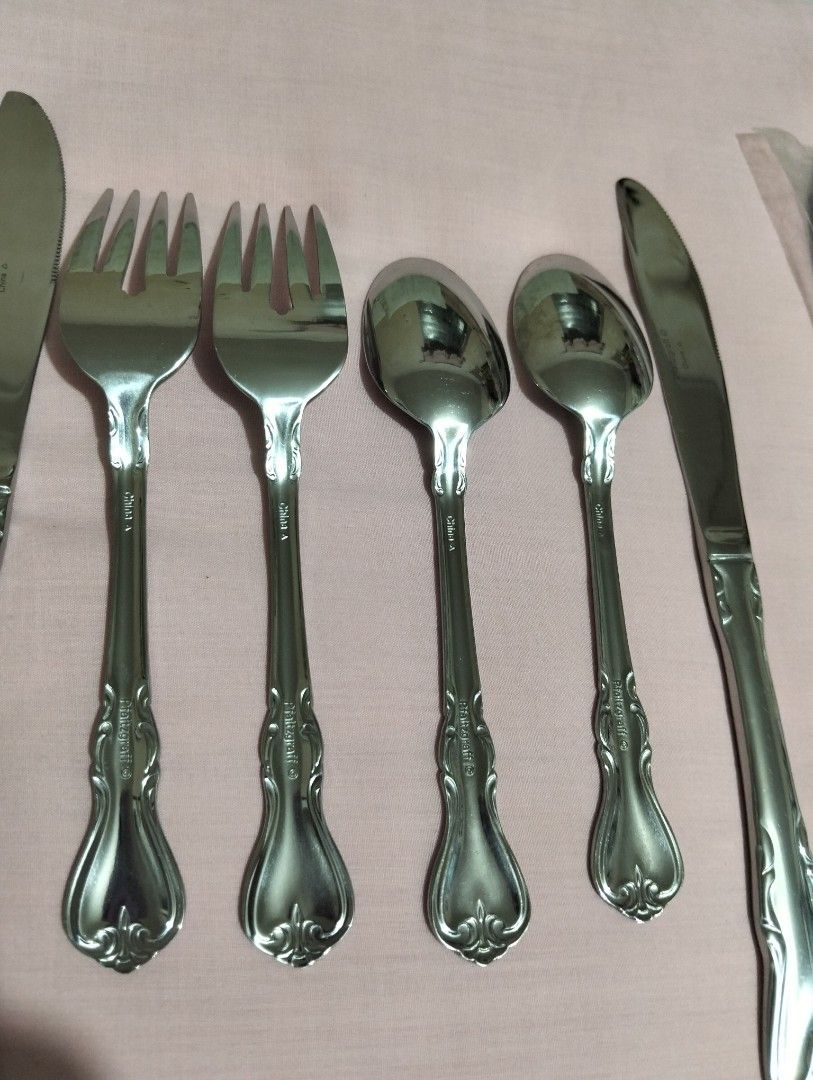 Pfaltzgraff Stainless Steel Flatware Cutlery Set (Category: Dinnerware & Cutlery) located in Manila. Submitted by bethistama04142 (Listing ID 1465620179, Image 2). Description: - Brand: Pfaltzgraff - Origin: Made in China - Material: Sturdy metal construction with a polished finish - Design: Elegant decorative scrollwork on handles - Set Includes: 10 pcs Dinner knives, 10 pairs of teaspoons & fork - Ideal for everyday dining or special occasions.