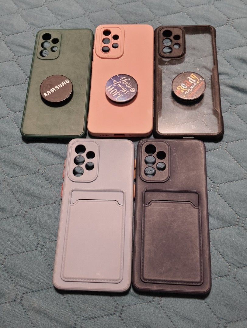 Phone Case for Samsung A335g (Category: Cases & Sleeves) located in Cavite. Submitted by missyblush88602 (Listing ID 1465655004, Image 1). Description: - Compatible Model: Samsung A33 5G - Variety of styles: Includes pop-socket designs (Green, Pink, Transparent) and card holder slot designs (Purple, Dark Navy Blue) - Pre-loved in good and usable condition ✨All 5 for 200✨.