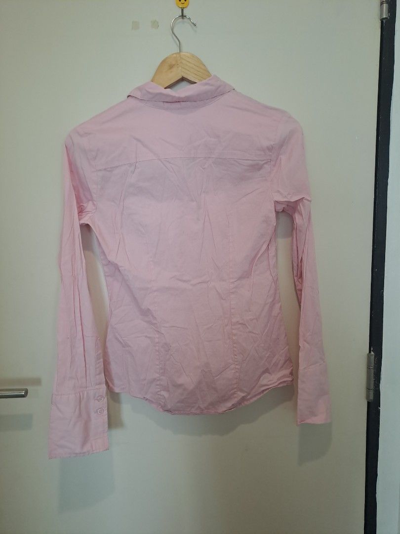 PIER/17 Baby pink longsleve (Category: Longsleeves) located in Manila. Submitted by joanbalde39643 (Listing ID 1465669420, Image 3). Description: This looks like a classic light pink button-up cotton shirt designed with a structured, waist-fitted silhouette. It features a classic pointed collar, standard button closures along the front placket, and long sleeves with buttoned cuffs..