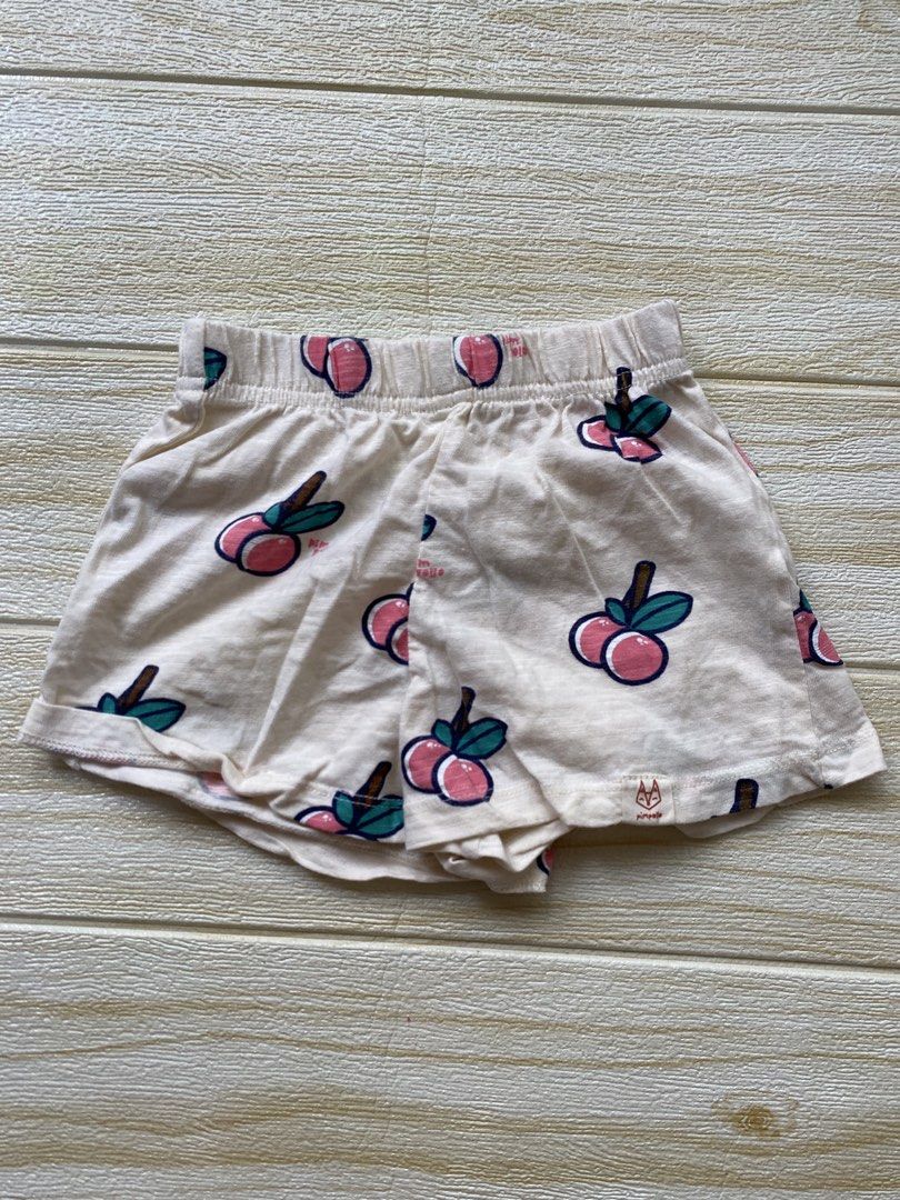 Pimpollo baby peach-print shorts (Category: Babies & Kids Fashion) located in Cebu City. Submitted by yjainani (Listing ID 1465590317, Image 1). Description: featuring a light cream or off-white base covered in a playful pattern of pink peaches with dark teal leaves.