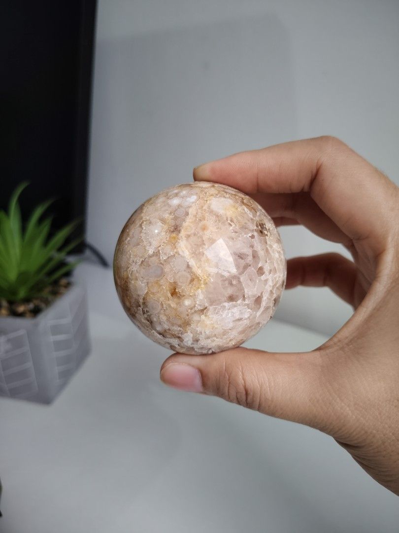 Pink Amethyst Crystal Sphere (Category: Precious Stones) located in Cavite. Submitted by lynlcb (Listing ID 1465651706, Image 2). Description: - Pink amethyst sphere with a smooth, highly polished finish - Features warm peach tones, translucent white spots, and sparkling druzy quartz pockets - Comfortable size that fits nicely in the palm of your hand - Beautiful reflective shine, perfect for display or meditation - weight is 286g.