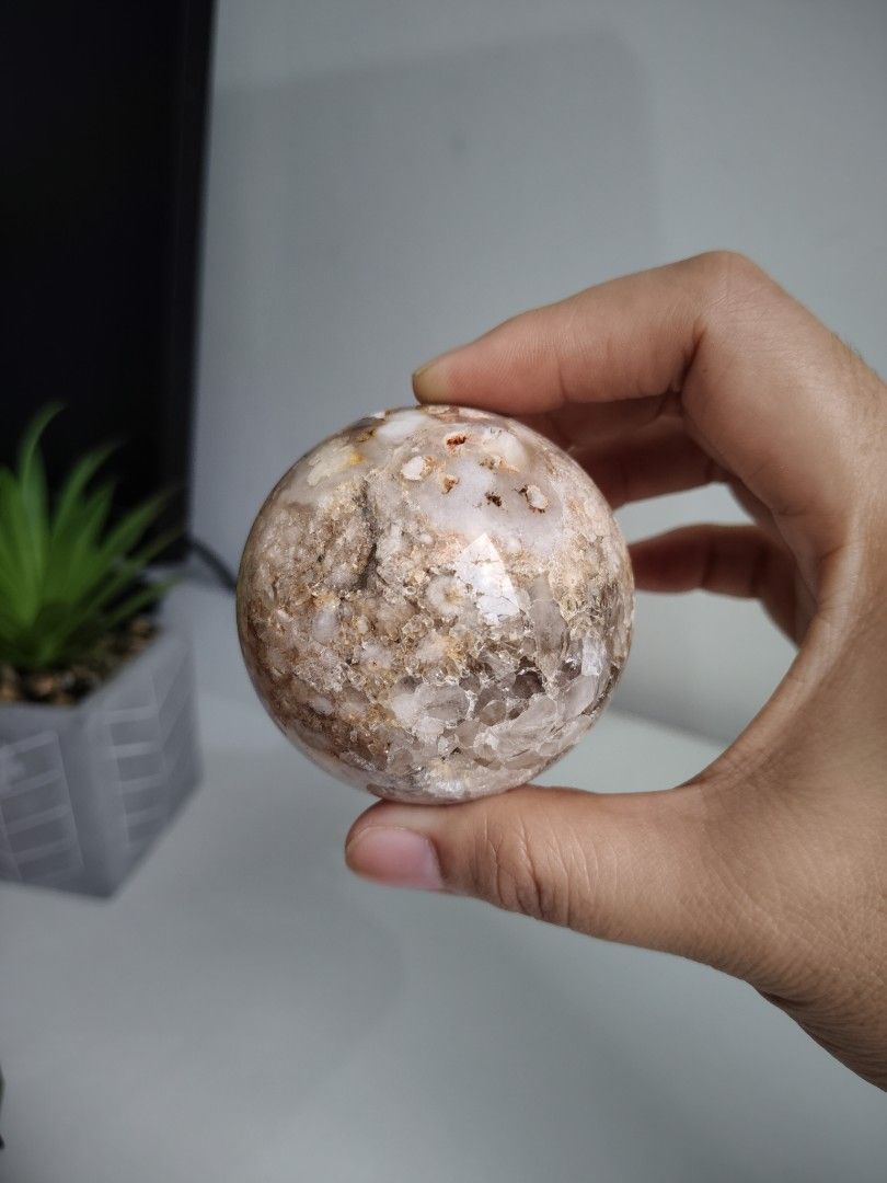Pink Amethyst Crystal Sphere (Category: Precious Stones) located in Cavite. Submitted by lynlcb (Listing ID 1465651706, Image 1). Description: - Pink amethyst sphere with a smooth, highly polished finish - Features warm peach tones, translucent white spots, and sparkling druzy quartz pockets - Comfortable size that fits nicely in the palm of your hand - Beautiful reflective shine, perfect for display or meditation - weight is 286g.