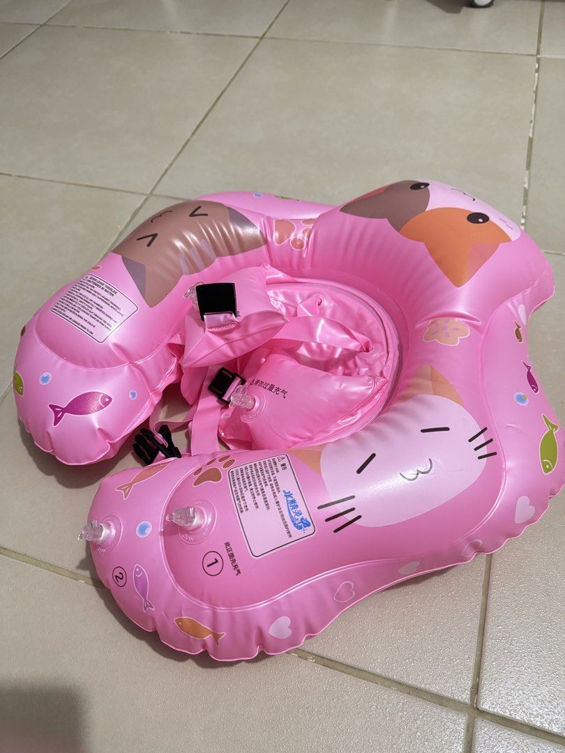 Pink Cute Cat Print Baby Swim Float Ring (Category: Babies & Kids Fashion) located in Pasay City. Submitted by decluttering_mom_2026 (Listing ID 1465674856, Image 2). Description: - Adorable pink design with cute cat graphics and colorful fish prints - Safe and secure with reliable safety buckles, adjustable straps, and multiple air chambers - Comfortable seat design to keep babies and toddlers fully supported - Lightweight and easily deflated fo