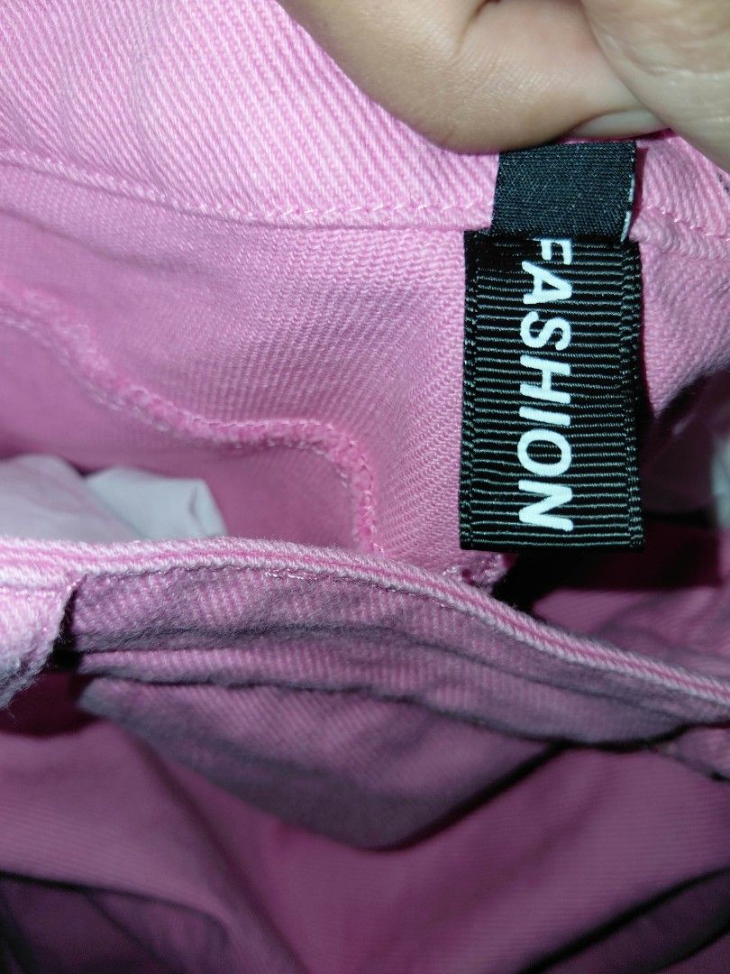Pink Denim Skirt (Category: Skirts) located in Manila. Submitted by risezaahh (Listing ID 1465691868, Image 2). Description: -pink denim skirt - Skirt features: Button closure, front pockets, and a cute fuzzy embroidered patch on the hem - Material: Sturdy, high-quality fabric - Style: Fun and casual, perfect for sunny days.