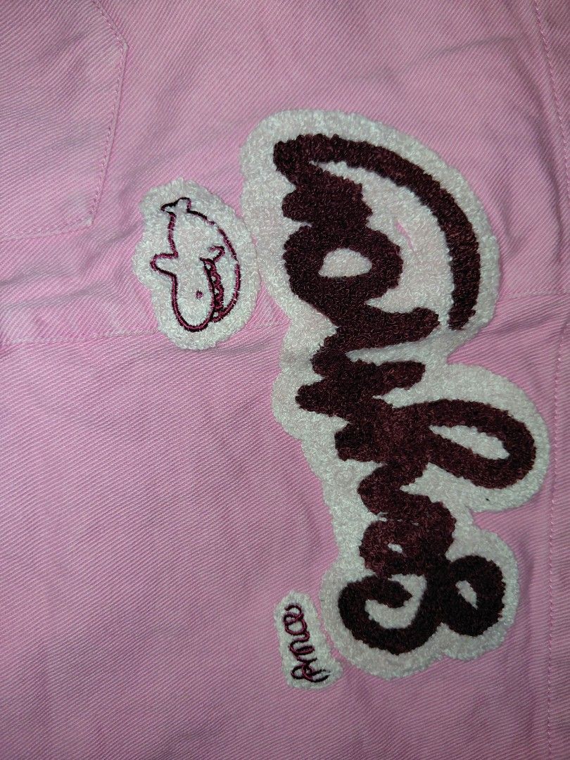 Pink Denim Skirt (Category: Skirts) located in Manila. Submitted by risezaahh (Listing ID 1465691868, Image 3). Description: -pink denim skirt - Skirt features: Button closure, front pockets, and a cute fuzzy embroidered patch on the hem - Material: Sturdy, high-quality fabric - Style: Fun and casual, perfect for sunny days.