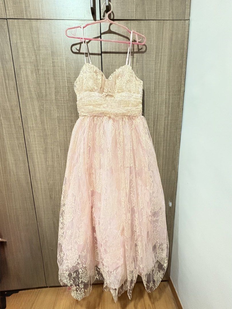 Pink Gold Lace Dress (Category: Dresses) located in Quezon City. Submitted by darshopxd (Listing ID 1465747711, Image 1). Description: - Pink midi dress with stunning metallic gold lace overlay - Sweetheart neckline with gathered bodice detailing - Adjustable spaghetti straps for a custom fit - Flared tulle skirt layer over a fully lined interior - Concealed back zipper closure for a seamless look - Soft and shimmery color combination, ideal for 