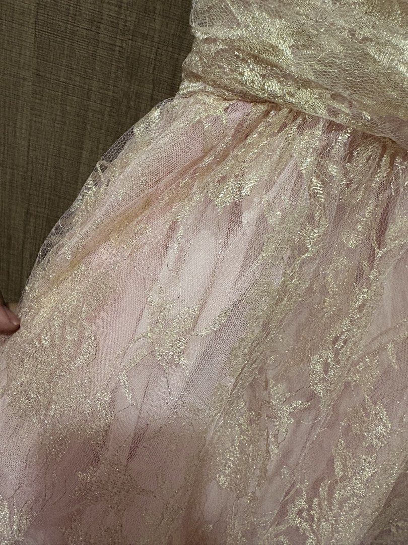 Pink Gold Lace Dress (Category: Dresses) located in Quezon City. Submitted by darshopxd (Listing ID 1465747711, Image 3). Description: - Pink midi dress with stunning metallic gold lace overlay - Sweetheart neckline with gathered bodice detailing - Adjustable spaghetti straps for a custom fit - Flared tulle skirt layer over a fully lined interior - Concealed back zipper closure for a seamless look - Soft and shimmery color combination, ideal for 