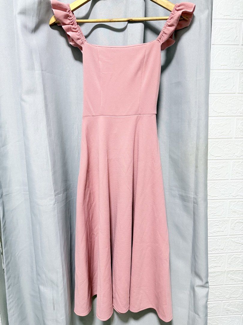 Pink Ruffle Strap Flare Midi Dress (Category: Dresses) located in Manila. Submitted by saichyy (Listing ID 1465660236, Image 1). Description: - Color: Dusty pink - Length: Midi (falls below the knee) - Neckline: Square neckline - Details: Ruffle straps and textured fabric - Fit: Fitted bodice with a defined waist seam and flared skirt - Occasion: Perfect for casual outings and dates.