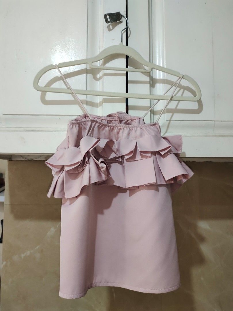 Pink Spaghetti Strap Ruffle Blouse Sleeveless Top (Category: Sleeveless) located in Manila. Submitted by alyssarodr96981 (Listing ID 1465649493, Image 1). Description: S: Small L = 19 W = 19 Condition: 9/10 Location: Pasig City MOP: GCash MOD: Lalamove, J&T (Upon availability, may take up to 5 days before shipping).