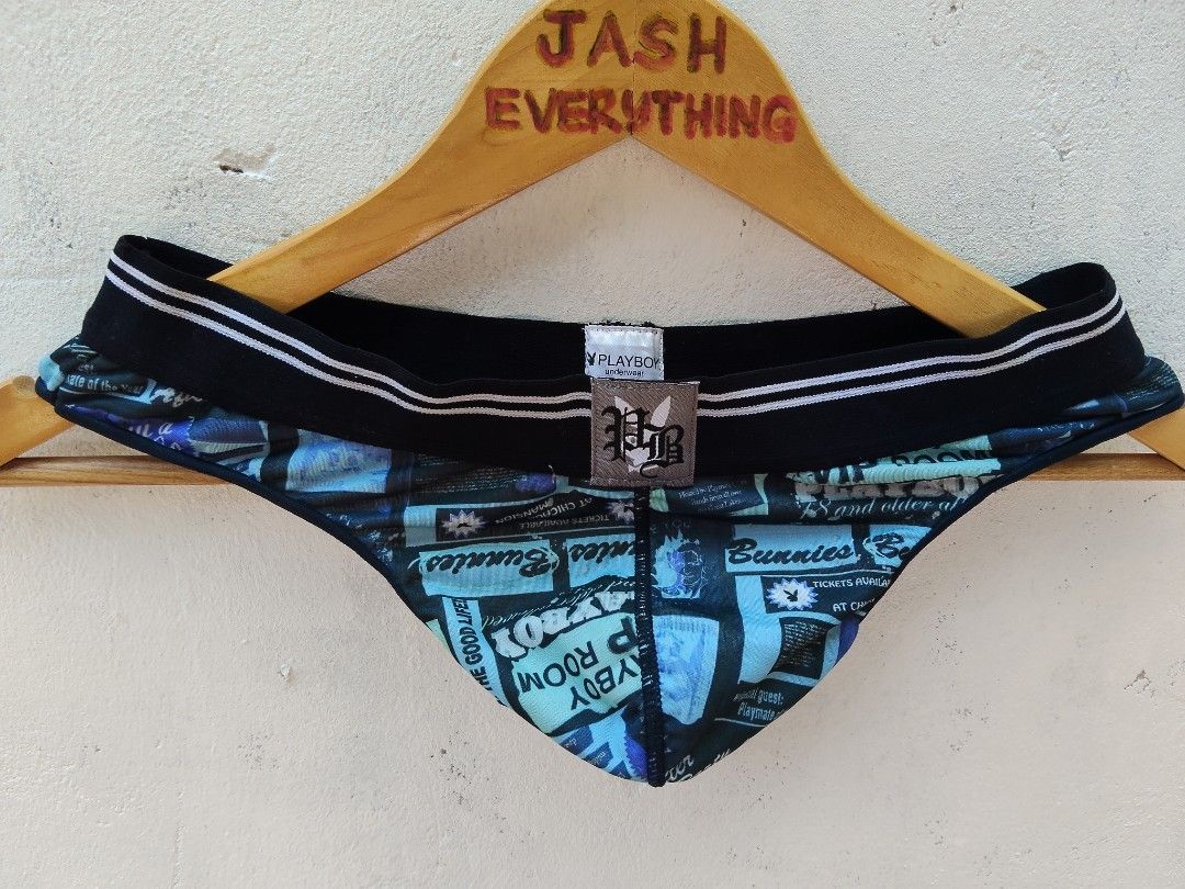 Playboy Underwear Blue Graphic Print Thong (Category: Undergarments & Loungewear) located in City of Isabela. Submitted by jasheverything (Listing ID 1465728106, Image 2). Description: - Brand: Playboy - Colors: Blue and black - Design: Graphic print with "Playboy Room" and "Bunnies" text details - Waistband: Black elastic with white stripes and front center branded patch - Material: Smooth, stretchy fabric for all-day comfort - Fit: Supportive, 