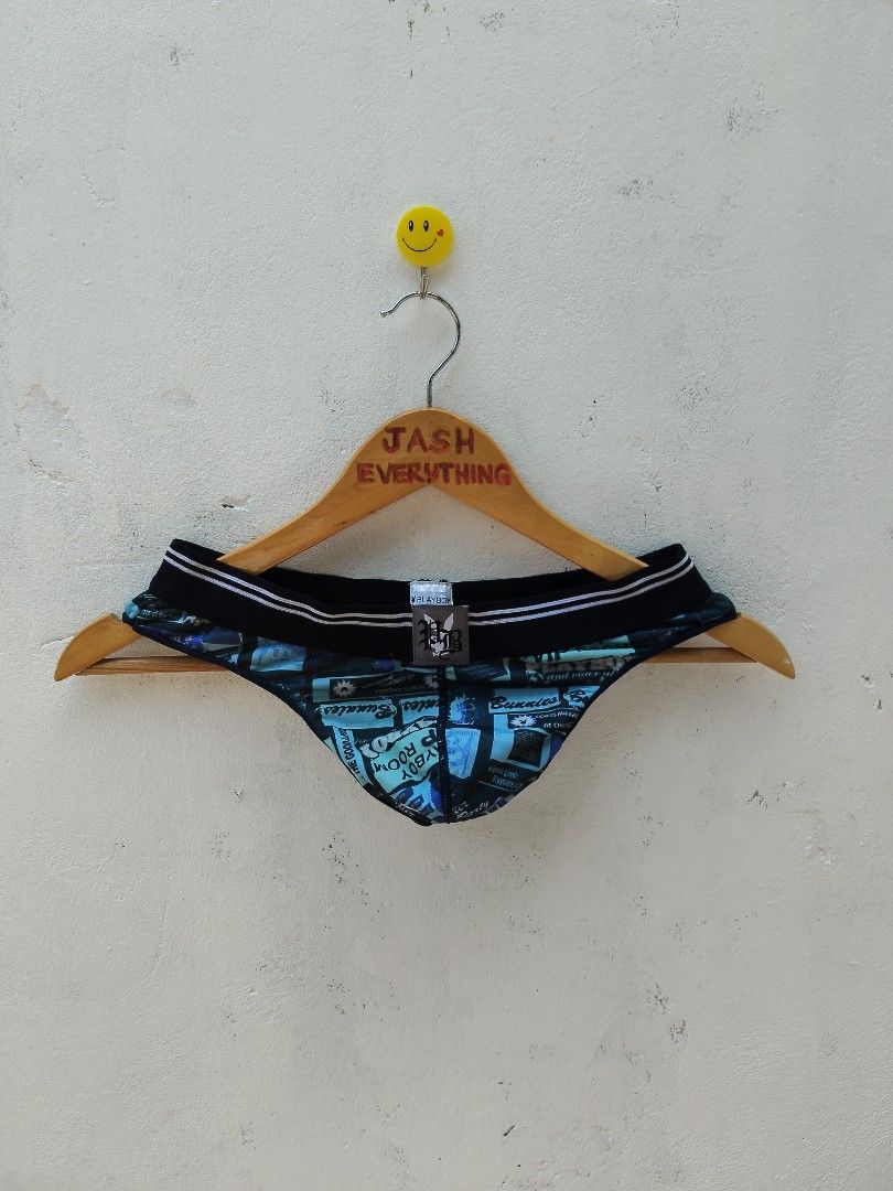 Playboy Underwear Blue Graphic Print Thong (Category: Undergarments & Loungewear) located in City of Isabela. Submitted by jasheverything (Listing ID 1465728106, Image 1). Description: - Brand: Playboy - Colors: Blue and black - Design: Graphic print with "Playboy Room" and "Bunnies" text details - Waistband: Black elastic with white stripes and front center branded patch - Material: Smooth, stretchy fabric for all-day comfort - Fit: Supportive, 