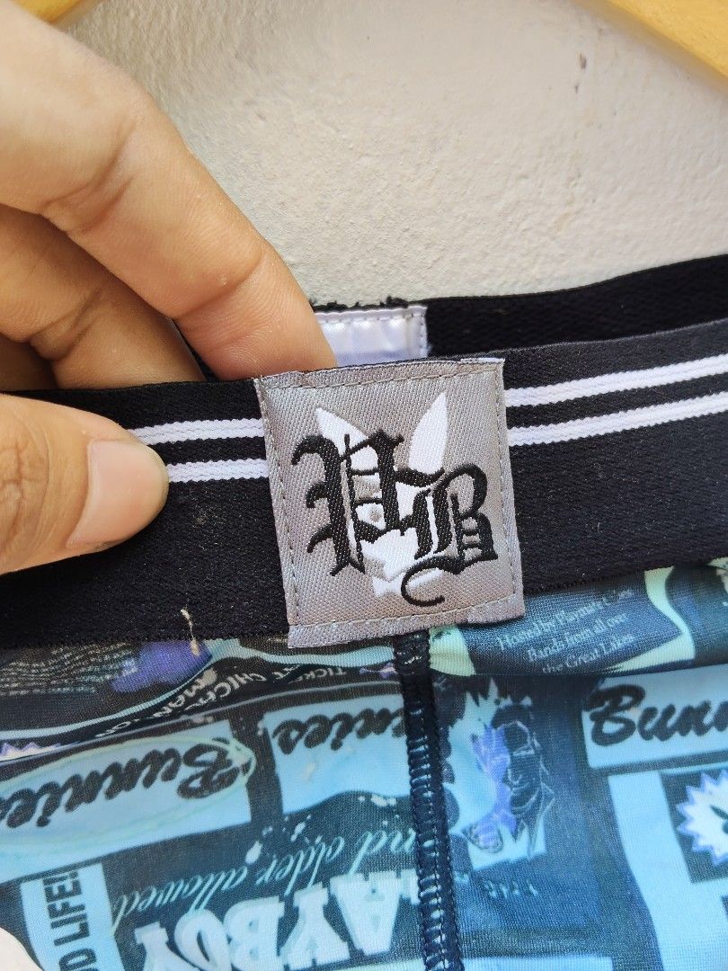 Playboy Underwear Blue Graphic Print Thong (Category: Undergarments & Loungewear) located in City of Isabela. Submitted by jasheverything (Listing ID 1465728106, Image 3). Description: - Brand: Playboy - Colors: Blue and black - Design: Graphic print with "Playboy Room" and "Bunnies" text details - Waistband: Black elastic with white stripes and front center branded patch - Material: Smooth, stretchy fabric for all-day comfort - Fit: Supportive, 