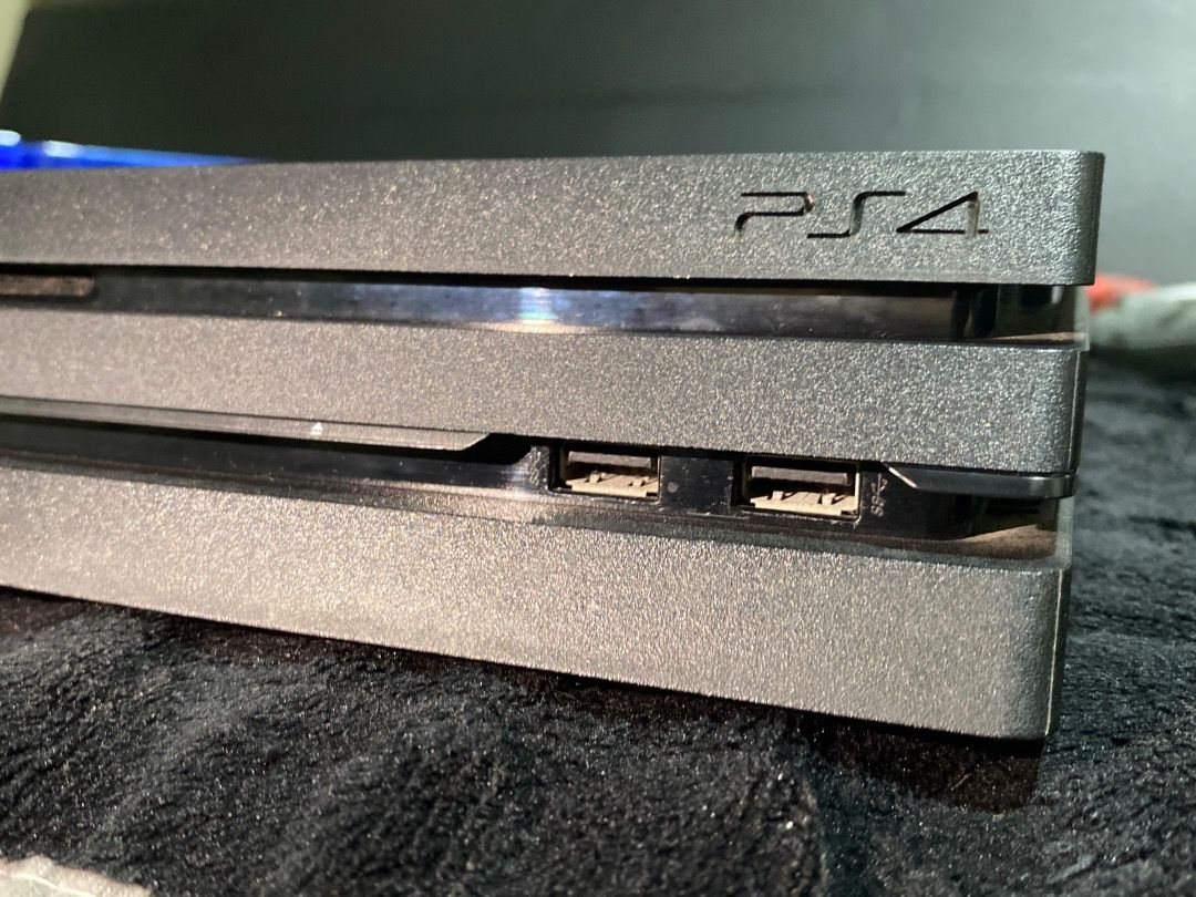 PlayStation 4 Pro (Category: PlayStation) located in Manila. Submitted by prelovedbychikky_ (Listing ID 1465691977, Image 2). Description: Brand: Sony Color: Black Condition: - Well-maintained, 100% working condition. - NO ISSUES. All features are working. - Fading of physical color appearance. Inclusion: - Console: Sony PlayStation 4 Pro CUH-7210B - Controller: 2x DualShock 4 Wireless Controllers (Red Camo & Grey Camo). With cord for charging. -