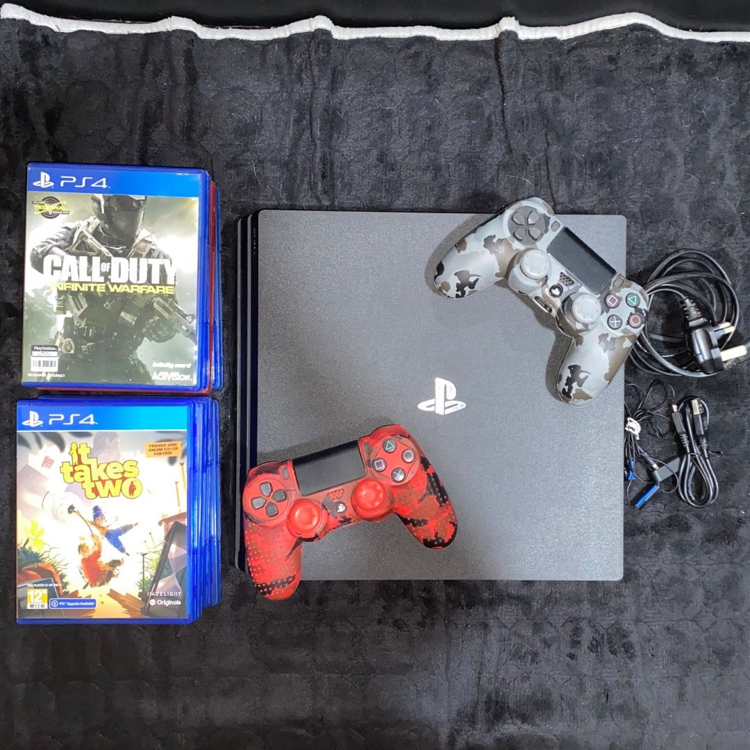 PlayStation 4 Pro (Category: PlayStation) located in Manila. Submitted by prelovedbychikky_ (Listing ID 1465691977, Image 1). Description: Brand: Sony Color: Black Condition: - Well-maintained, 100% working condition. - NO ISSUES. All features are working. - Fading of physical color appearance. Inclusion: - Console: Sony PlayStation 4 Pro CUH-7210B - Controller: 2x DualShock 4 Wireless Controllers (Red Camo & Grey Camo). With cord for charging. -