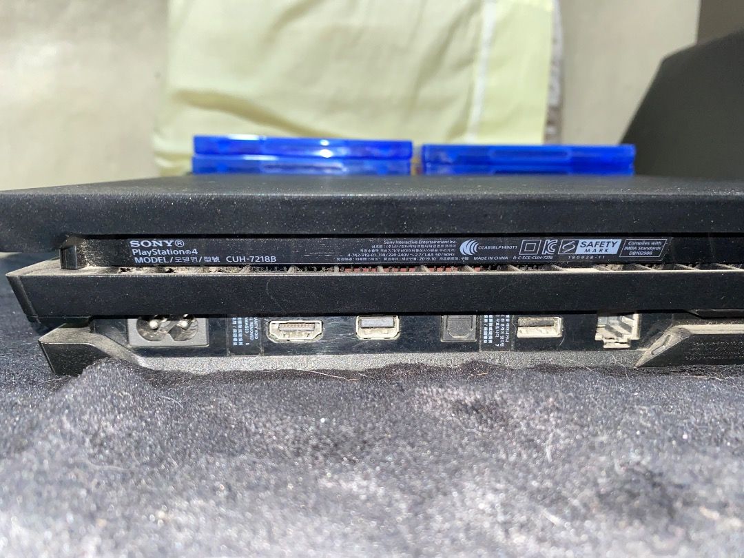 PlayStation 4 Pro (Category: PlayStation) located in Manila. Submitted by prelovedbychikky_ (Listing ID 1465691977, Image 3). Description: Brand: Sony Color: Black Condition: - Well-maintained, 100% working condition. - NO ISSUES. All features are working. - Fading of physical color appearance. Inclusion: - Console: Sony PlayStation 4 Pro CUH-7210B - Controller: 2x DualShock 4 Wireless Controllers (Red Camo & Grey Camo). With cord for charging. -