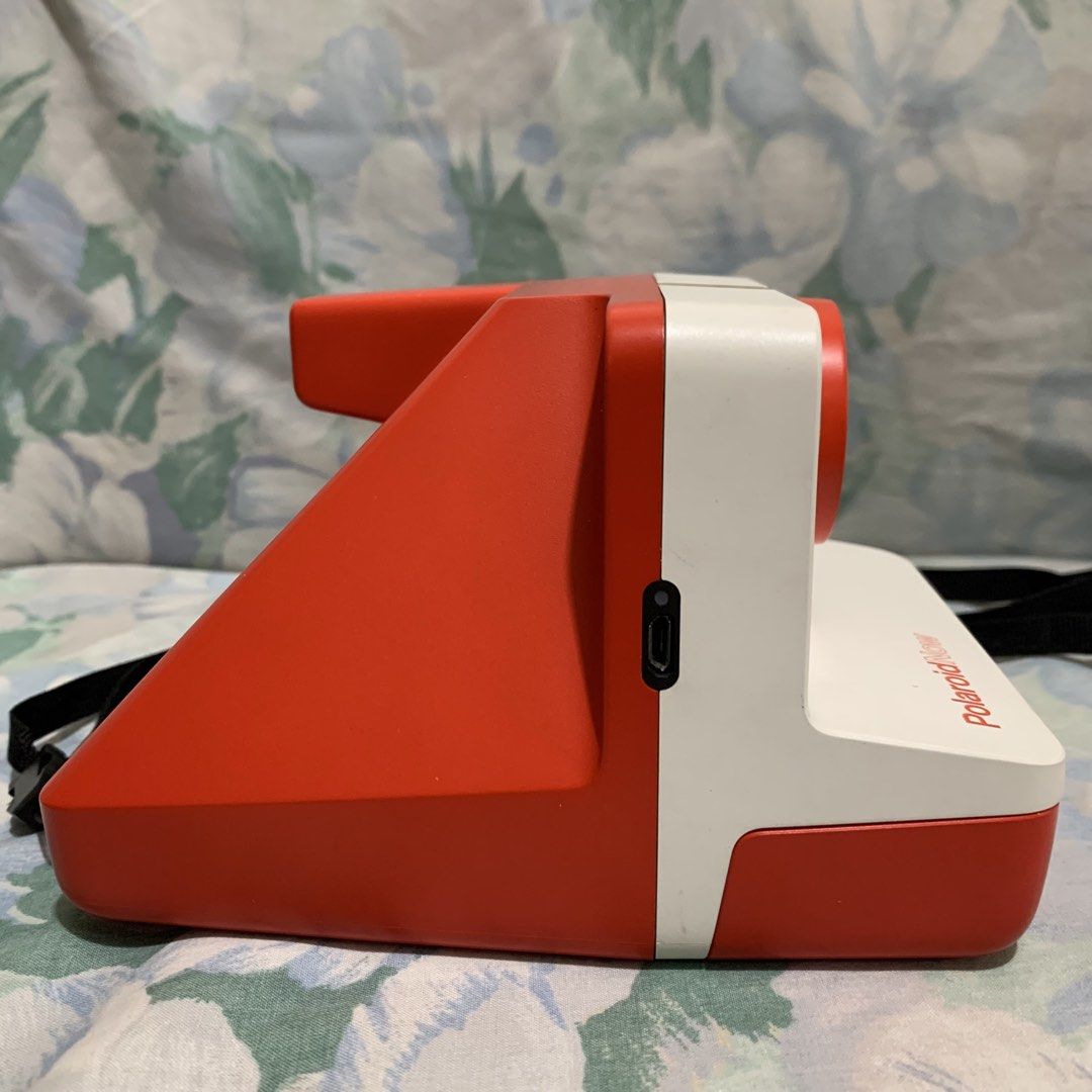 Polaroid Now Autofocus i-Type Instant Camera Red White (Category: Cameras) located in Manila. Submitted by coolstuffonlyyy (Listing ID 1465608316, Image 2). Description: - Model: Polaroid Now Instant Camera - Color: Red and White - Features: Autofocus lens, built-in flash, and USB rechargeable - Compatibility: Uses i-Type film - Condition: Tested and works great - Inclusions: Original box and charging cable - Perfect for: Parties, trips, and ever
