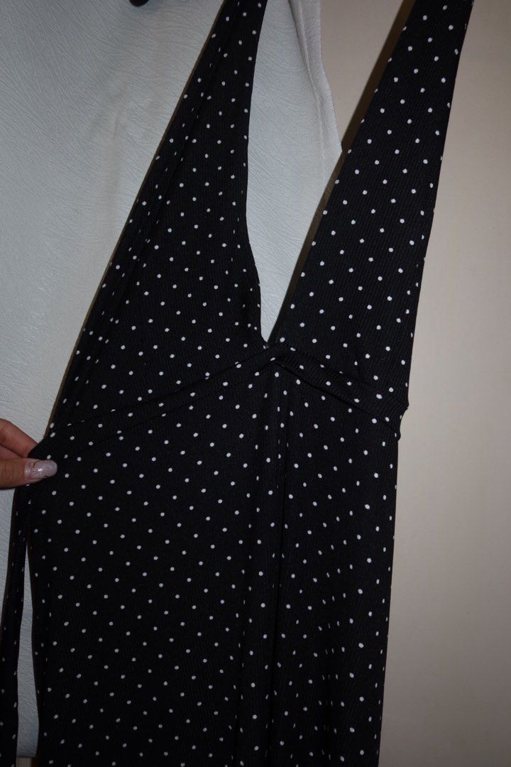 Polkadots Backless Halter Dress (Category: Dresses) located in Cavite. Submitted by mcjkim (Listing ID 1465680708, Image 2). Description: - Brand: Flair Clothing (Martha dress) - Design: Black with all-over white polka dots - Style: Backless, halter neck, deep V-cut, and tie detail at the back waist - Fit: Long length, body-hugging - Condition: Worn twice, like new - Perfect for: Date nights and nights out.