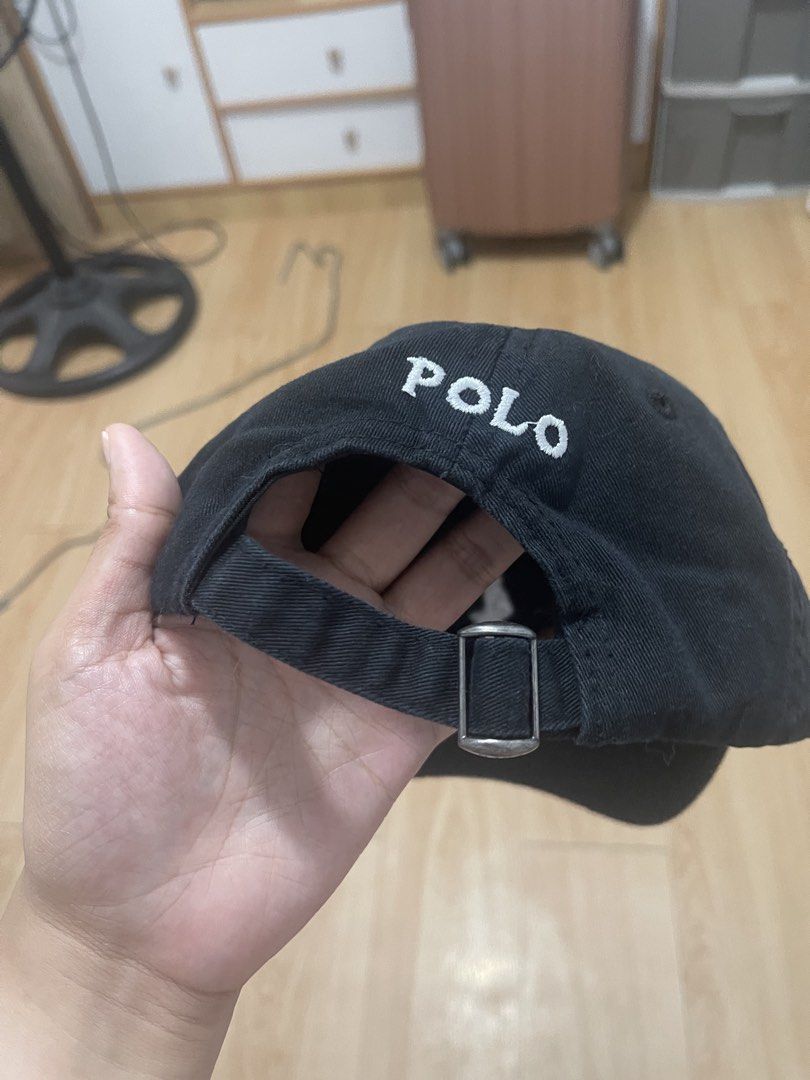 Polo Ralph Lauren Black Cap (Category: Caps & Hats) located in Manila. Submitted by jvlni (Listing ID 1465653226, Image 3). Description: - Brand: Polo Ralph Lauren - Color: Classic Black with White Embroidered Pony Logo - Material: 100% Cotton for comfortable everyday wear - Size: One size fits all, fully adjustable strapback with a metal buckle - Details: Features 'POLO' lettering embroidered on the back and original interior branding tags - Con