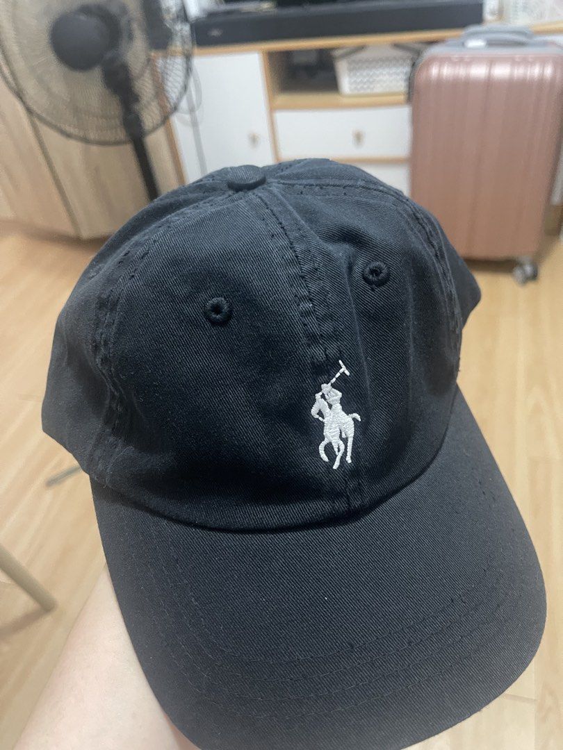 Polo Ralph Lauren Black Cap (Category: Caps & Hats) located in Manila. Submitted by jvlni (Listing ID 1465653226, Image 1). Description: - Brand: Polo Ralph Lauren - Color: Classic Black with White Embroidered Pony Logo - Material: 100% Cotton for comfortable everyday wear - Size: One size fits all, fully adjustable strapback with a metal buckle - Details: Features 'POLO' lettering embroidered on the back and original interior branding tags - Con